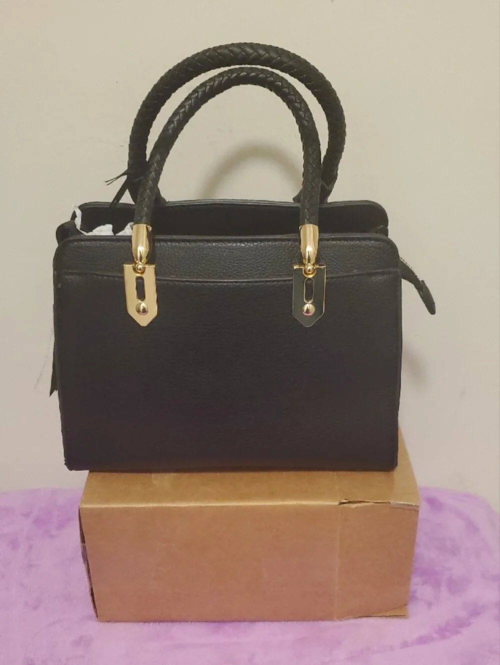 Structured Black Satchel with Braided Handles and Gold Accents